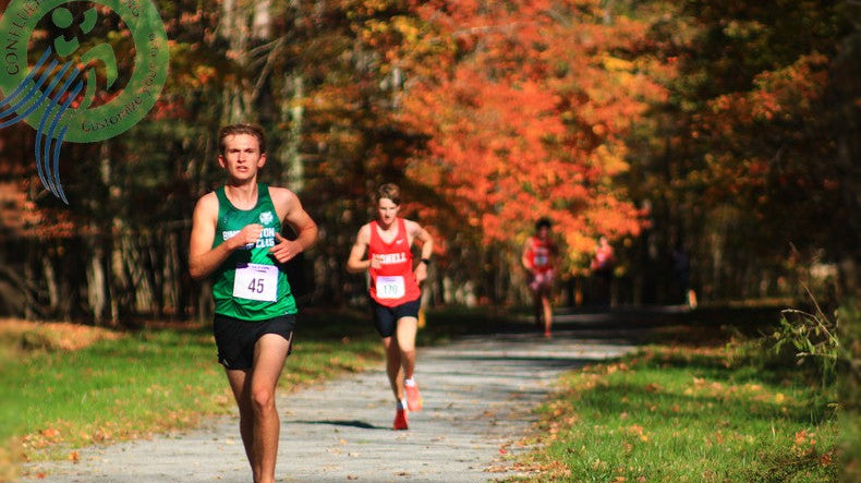 Binghamton runner in green ahead of Cornell competitors on the 2026 BRC Open men's cross country course