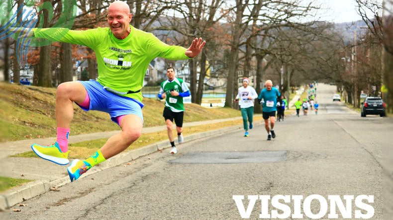 Bob Stocks, runner, clicking his heels at the St Pats 4 Miler Binghamton NY