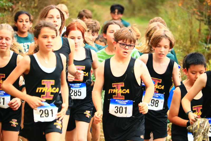 Arlo, a 7th grader, running in a Cross Country race for the Ithaca City School District with his team