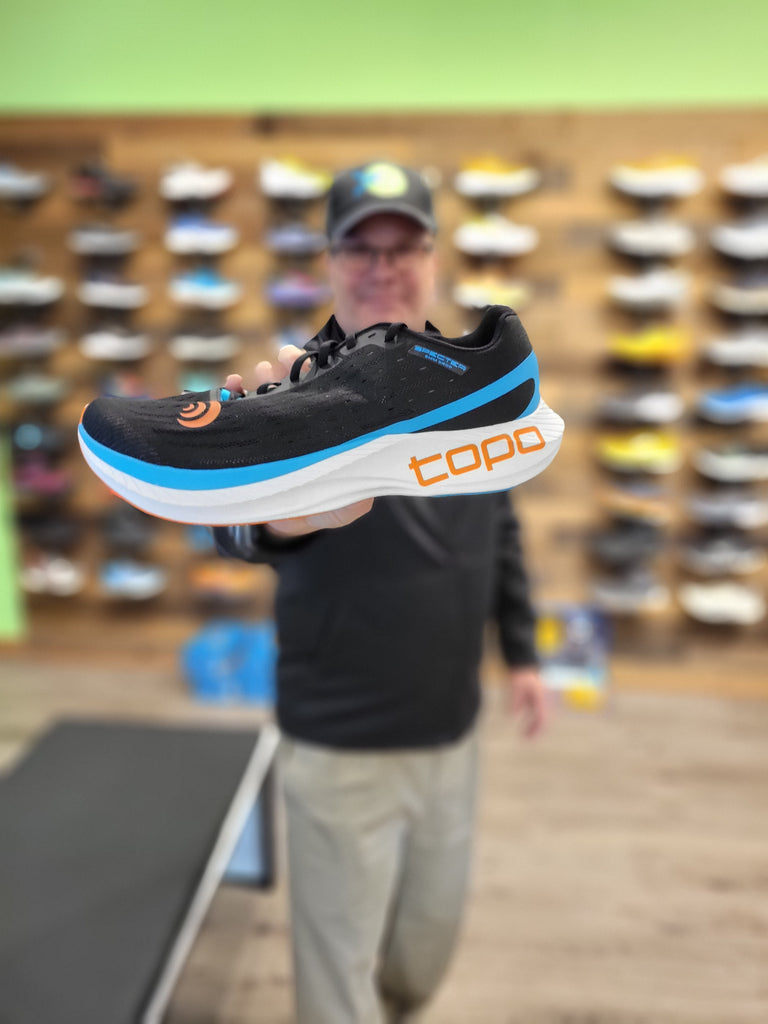 Employee with his favorite shoe: The black and blue Topo Specter