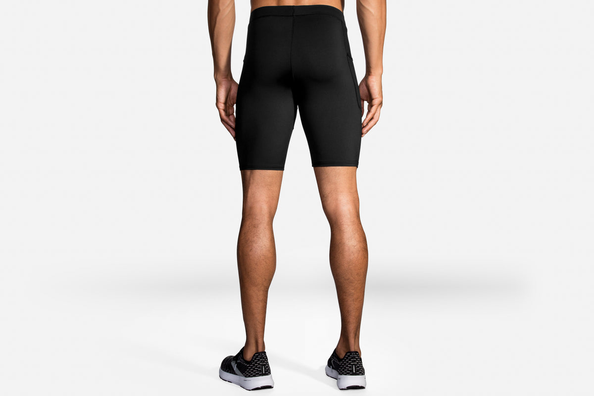 Men's Brooks Source 9" Tights. Black. Rear view.