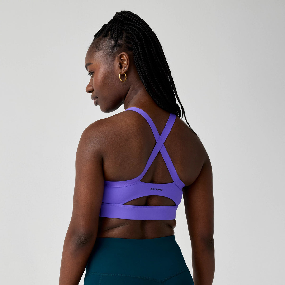 Women's Brooks Luxe Strappy Sports Bra in Violet, back view.