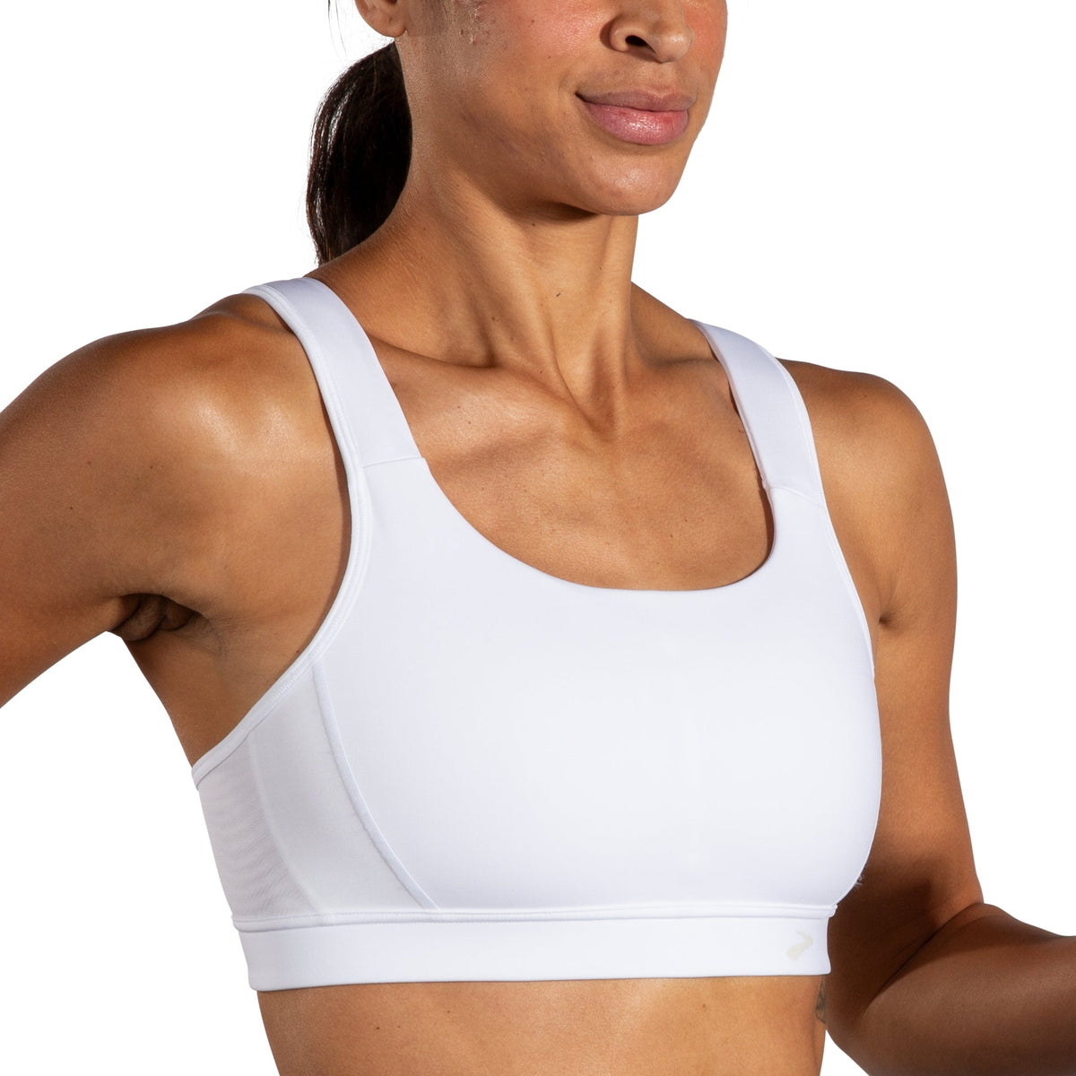 Women's Brooks Convertible 2.0 Sports Bra in White, model view.
