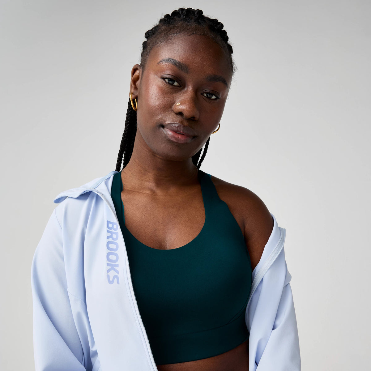 Women's Brooks Limitless Racerback Sports Bra in Cosmo, model view.