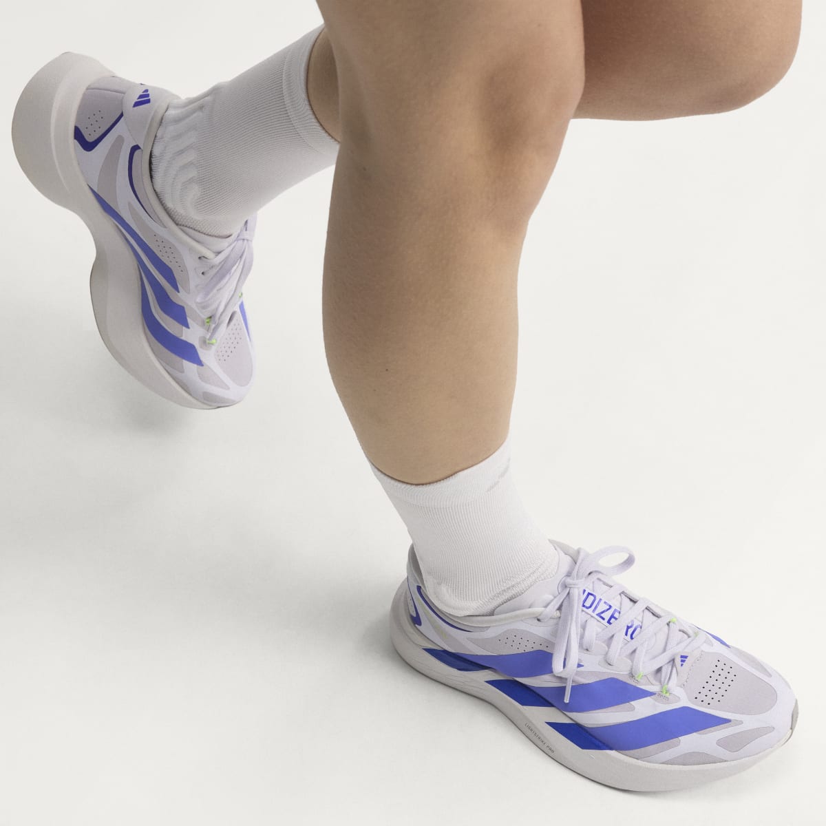 Adidas Adizero Evo SL EXO women's running shoe in Silver Dawn/Solar Purple/Frozen Purple — on-foot side view