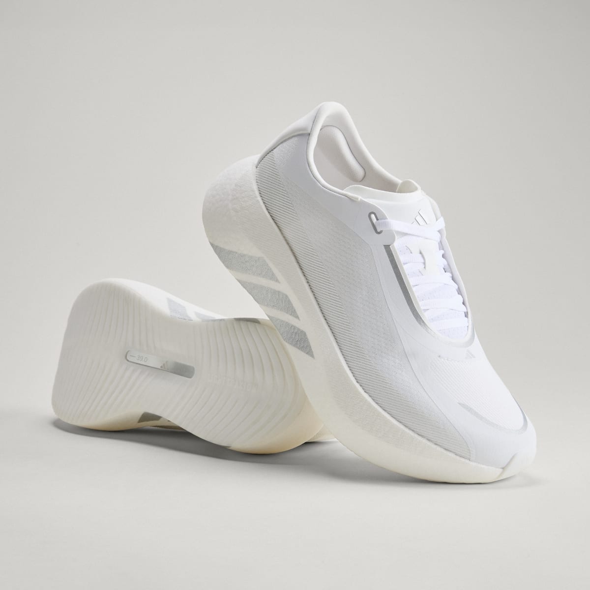 Adidas Hyperboost Edge men's running shoe in Cloud White/Silver Metallic/Zero Metallic — angled pair with outsole visible.