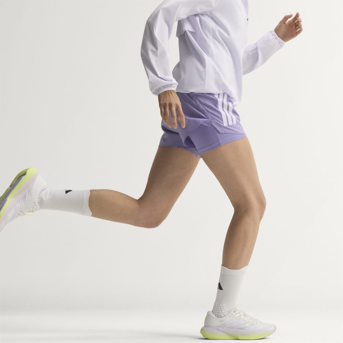 Adidas Supernova Rise 3 women's running shoe in Crystal White/Silver Metallic/Purple Tint — running lifestyle view