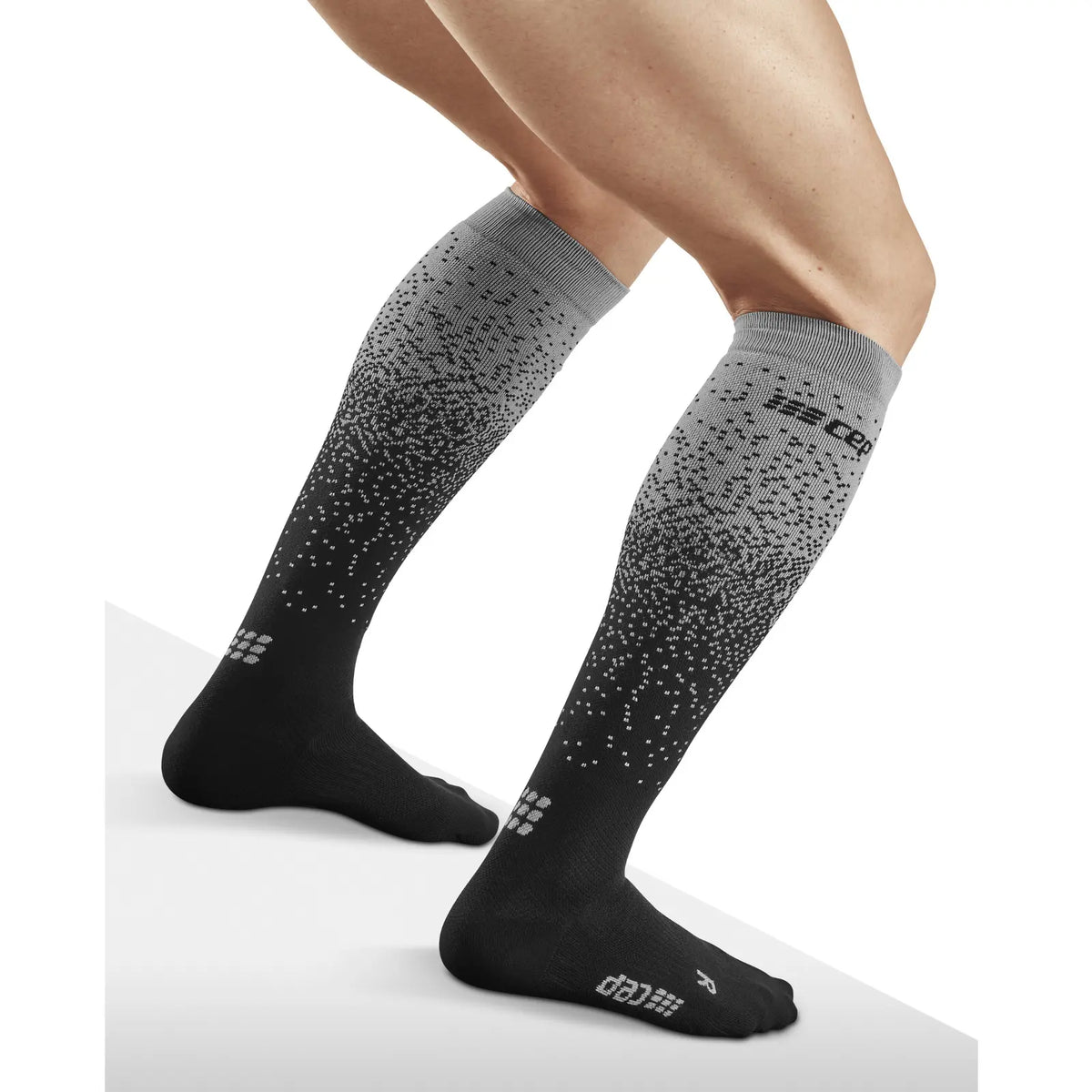 CEP men's Ski Snowfall Compression Socks in Black/Off White, rear angle