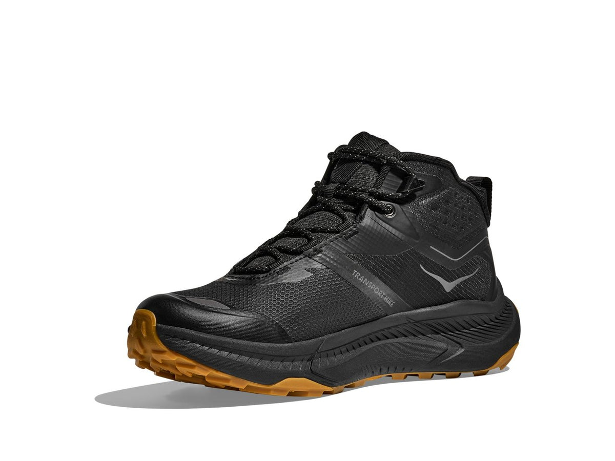 HOKA Transport Hike GTX men's hiking shoe in Black/Black, angled side view