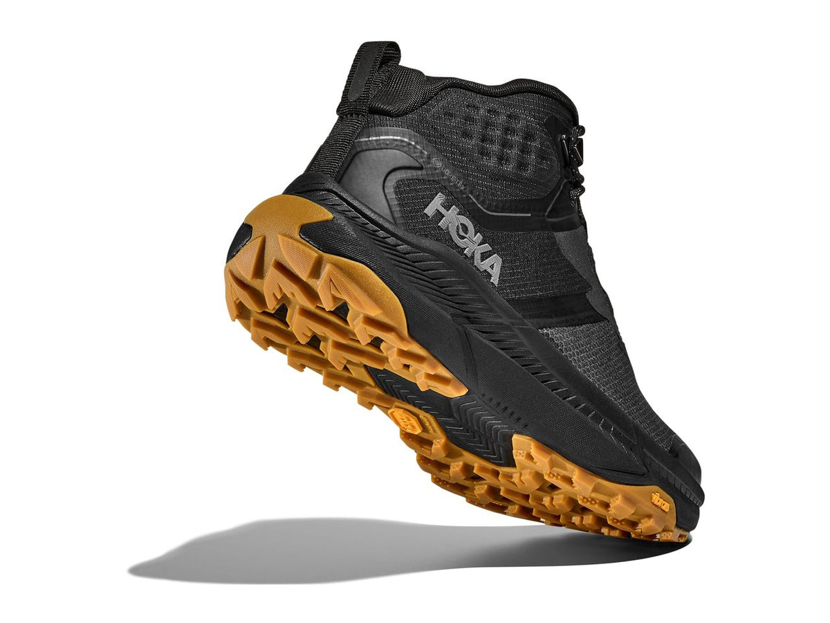 HOKA Transport Hike GTX men's hiking shoe in Black/Black, rear outsole view