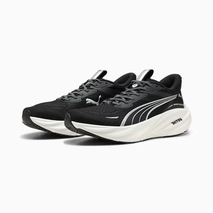 Black running shoes with white soles on a white background