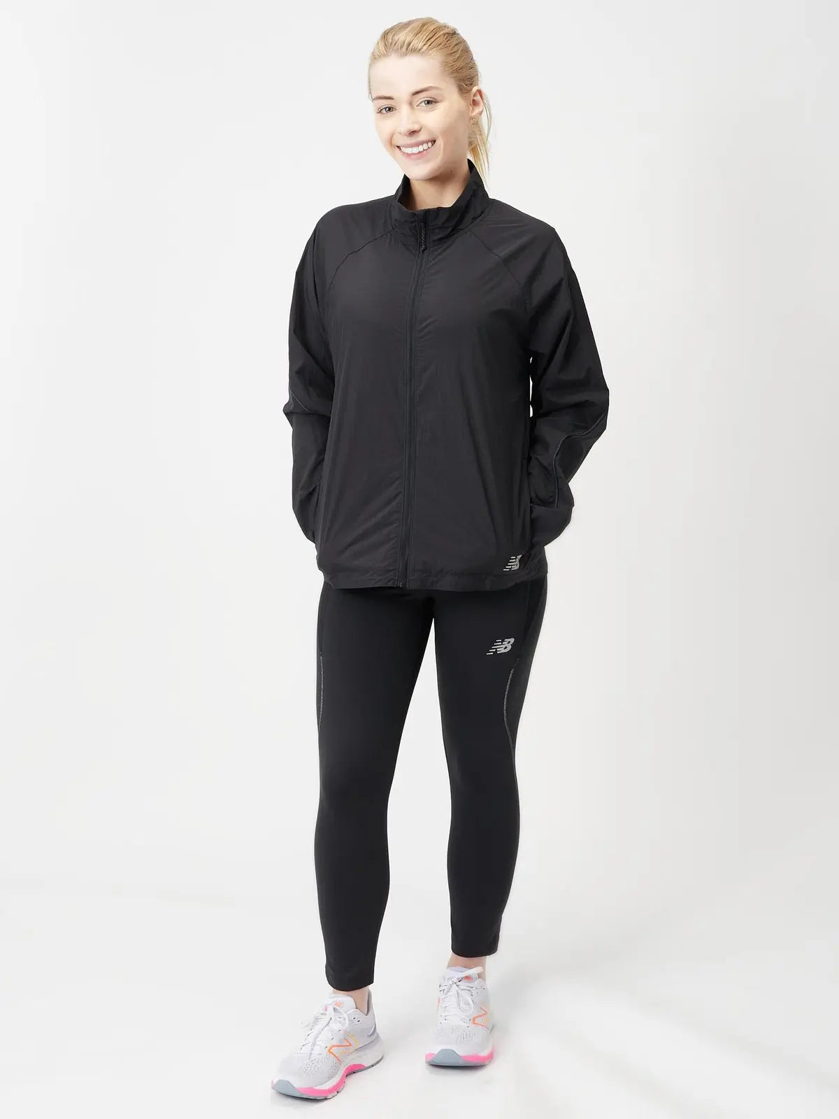 New Balance women's Impact Run Jacket in Black, full-length fit