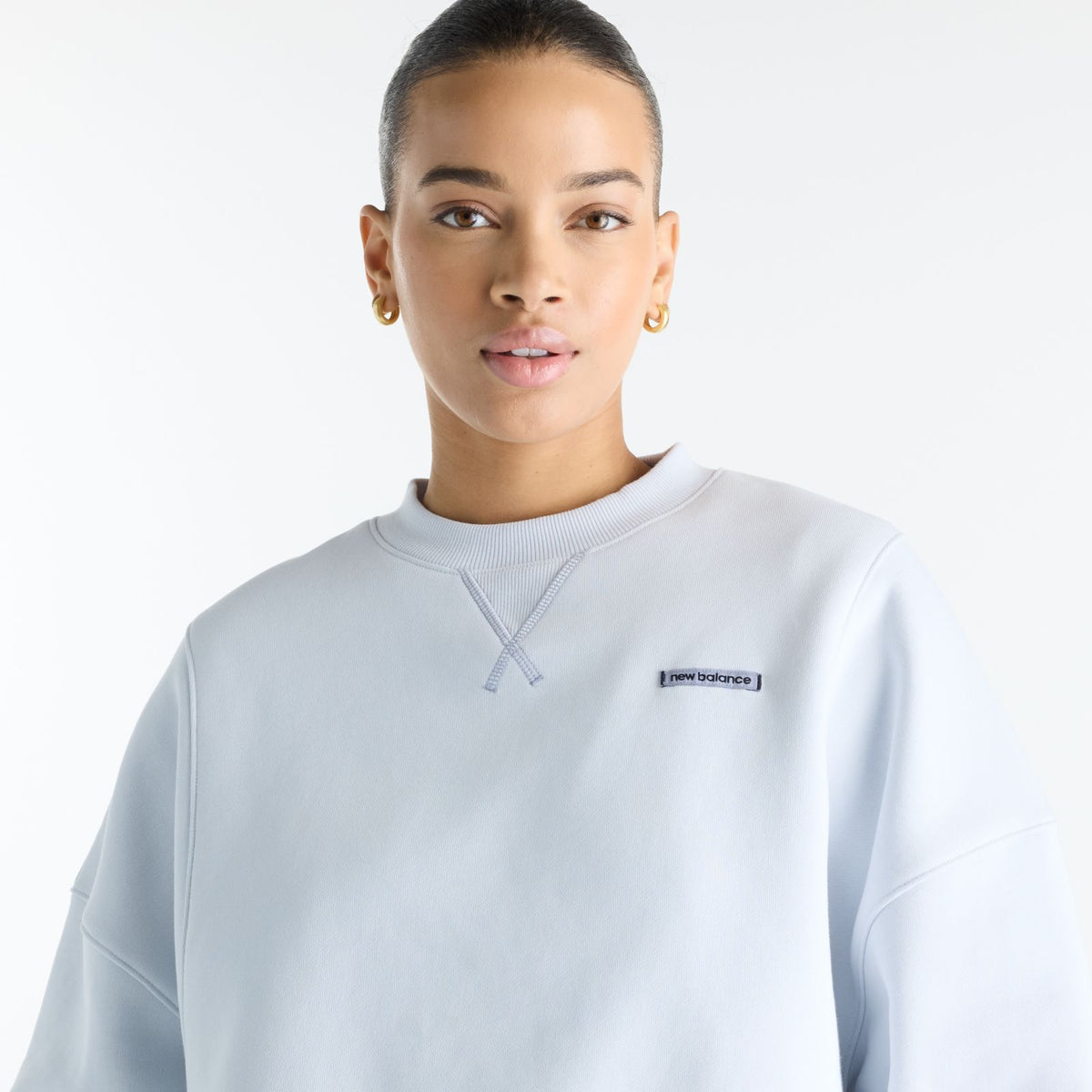 Woman wearing New Balance Sydney Levrone Athletics Crafted Crew in Fresh Air view 1