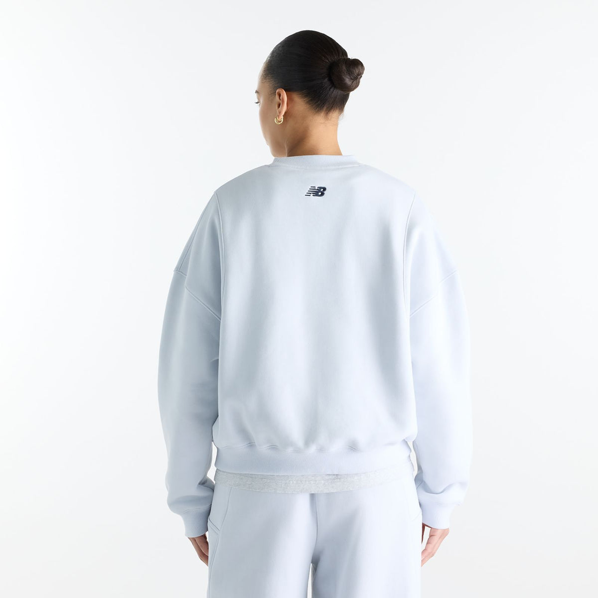 Woman wearing New Balance Sydney Levrone Athletics Crafted Crew in Fresh Air view 2