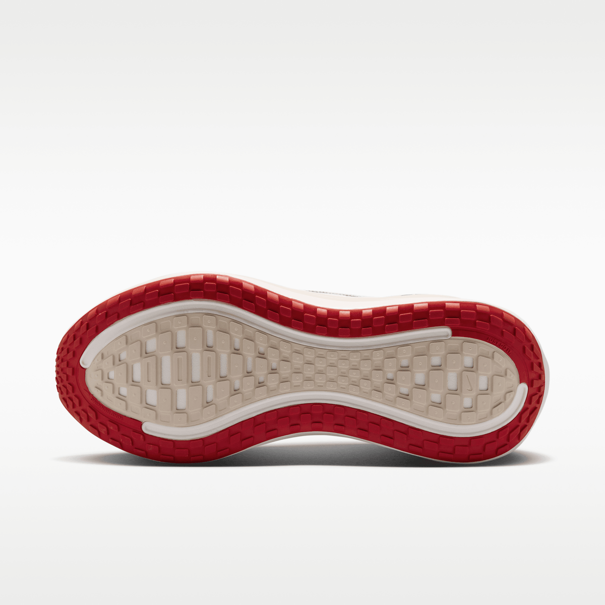 Nike Vomero Plus men's shoes in Sail/Black/University Red with animal-print upper — outsole view.