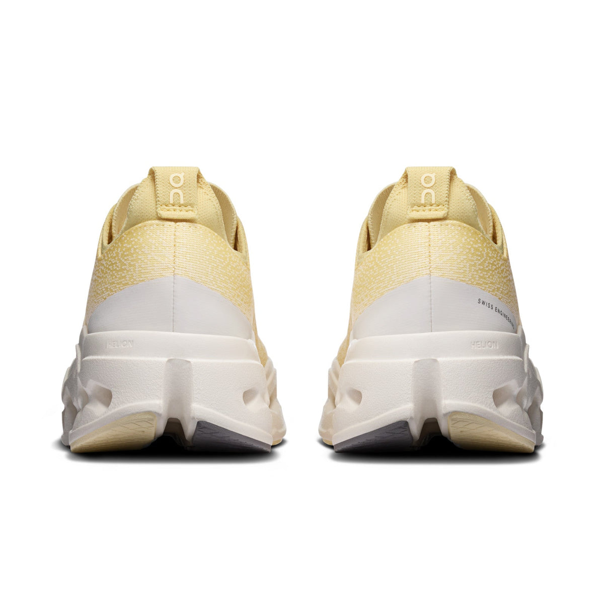 On Running Cloudsurfer Max women's running shoe in Dijon/Ivory — rear view of the pair