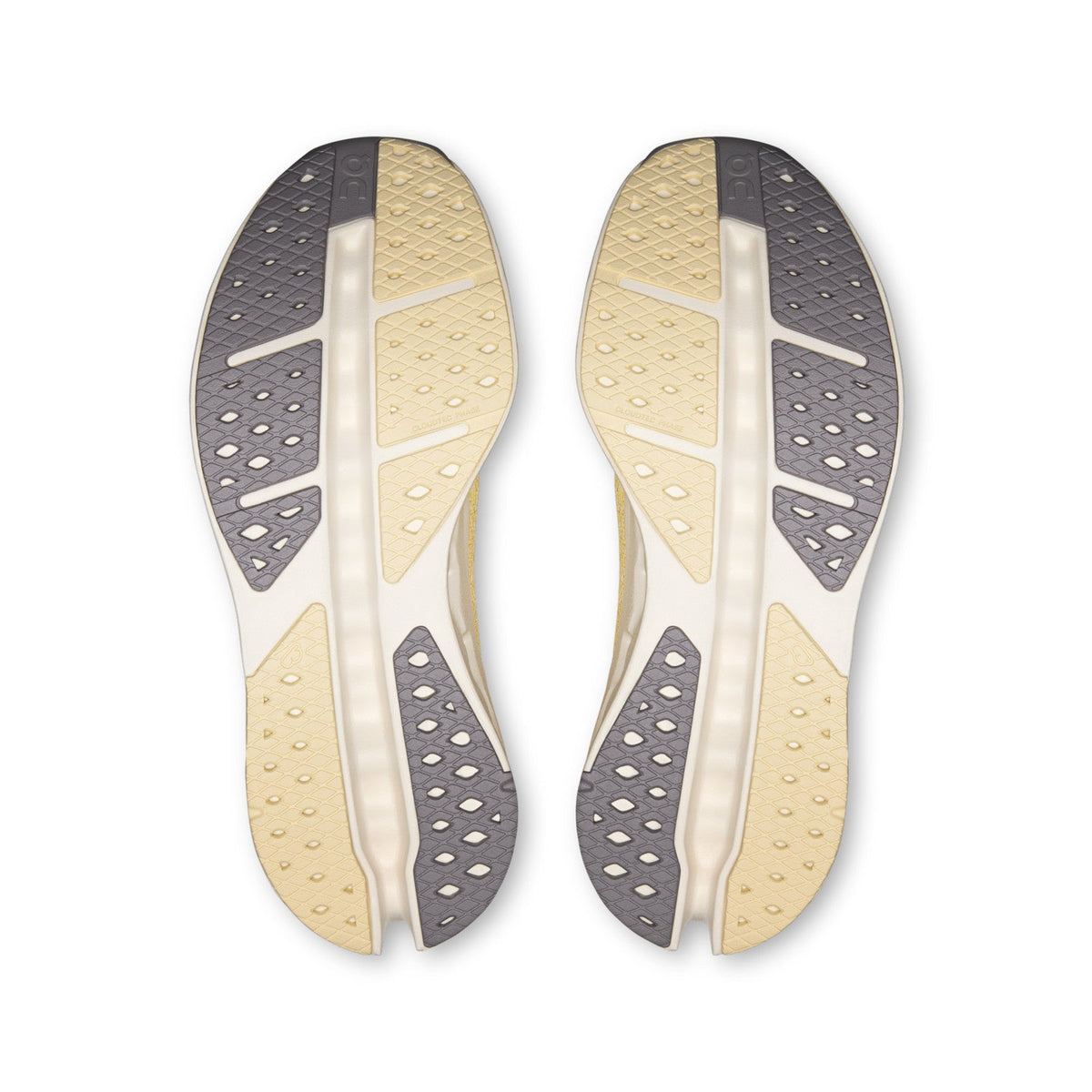 On Running Cloudsurfer Max women's running shoe in Dijon/Ivory — outsole view of the pair