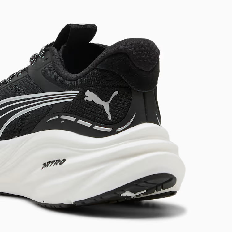 Black and white Puma sneaker with visible brand logo on a white background