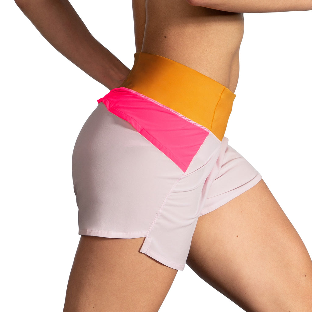 Women's Brooks Chaser 5" Shorts. White/Pink/Orange. Lateral view.