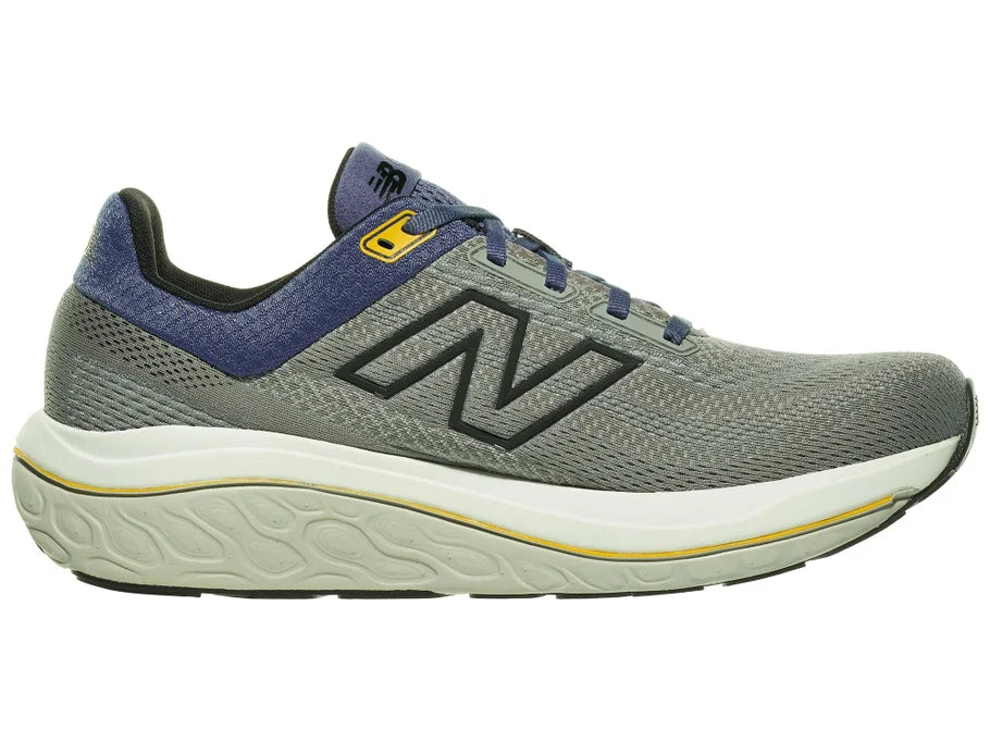 Men's New Balance 860 v14. Grey upper. Off White midsole. Medial view.