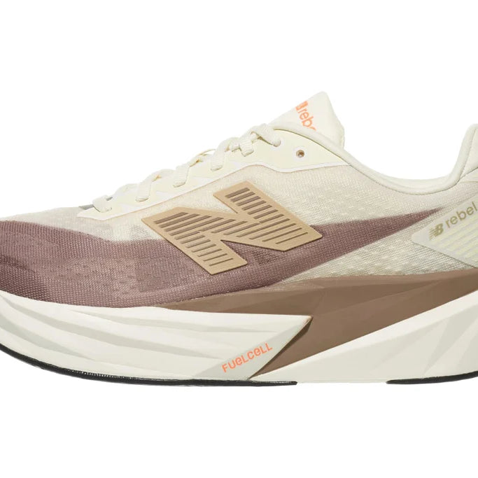 Men's New Balance Rebel v5. Off White/Tan upper. Off White/Tan midsole. Lateral view.