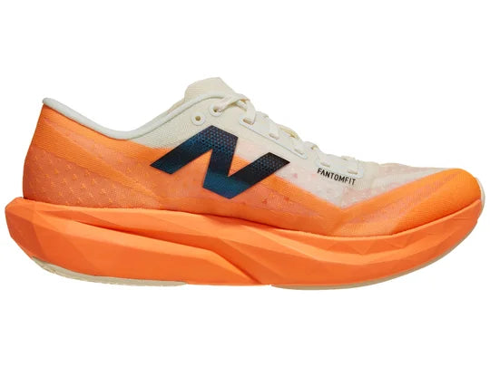 Men's New Balance FuelCell Rebel v4 in Hot Mango/Angora/Black — medial view