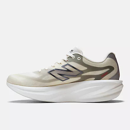Men's New Balance Supercomp Rebel. Beige upper. White midsole. Medial view.