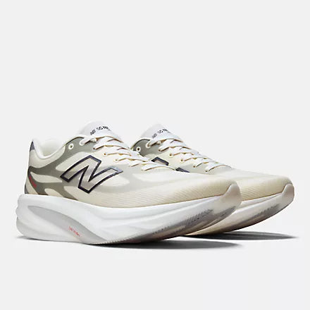 Men's New Balance Supercomp Rebel. Beige upper. White midsole. Lateral view.
