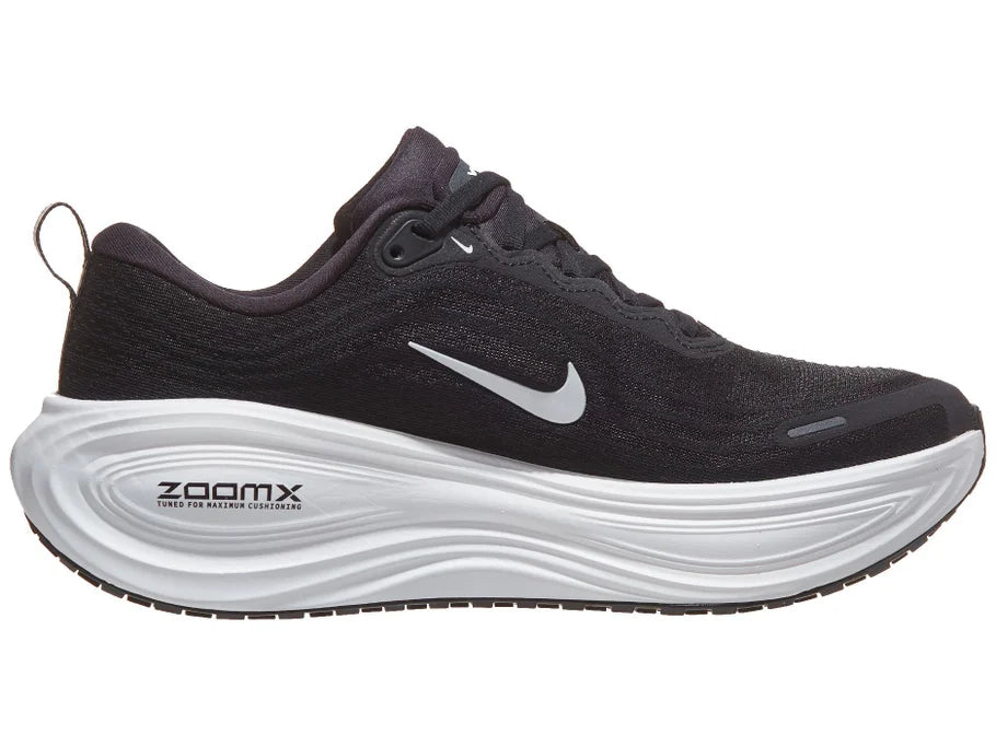 Men's Nike Vomero Plus. Black upper. White midsole. Medial view.