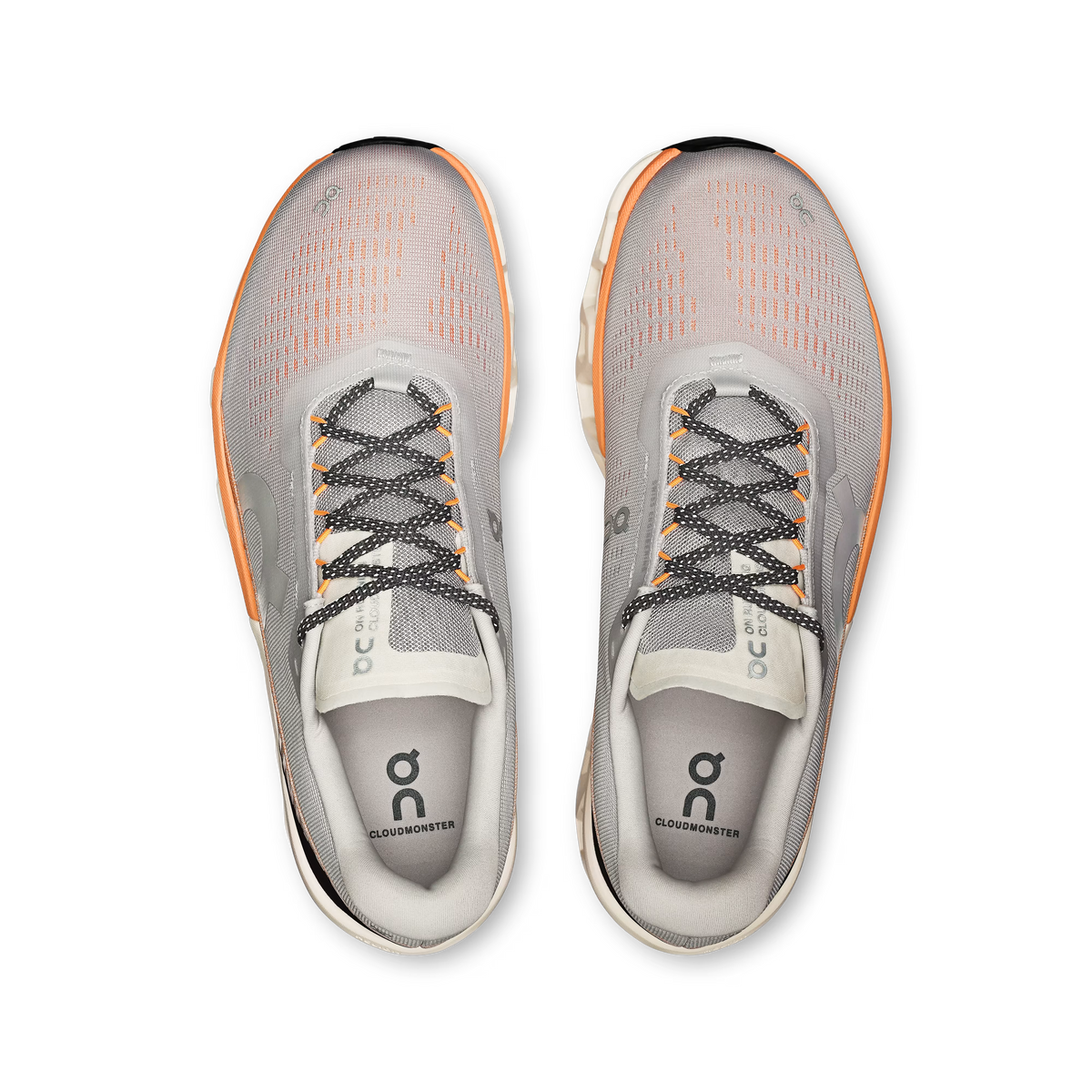 Men's On Cloudmonster 2. Cream and orange upper. Cream and orange midsole. Top view.