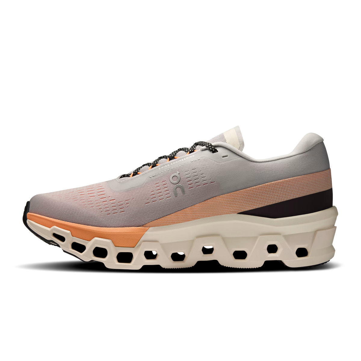 Men's On Cloudmonster 2. Cream and orange upper. Cream and orange midsole. Medial view.