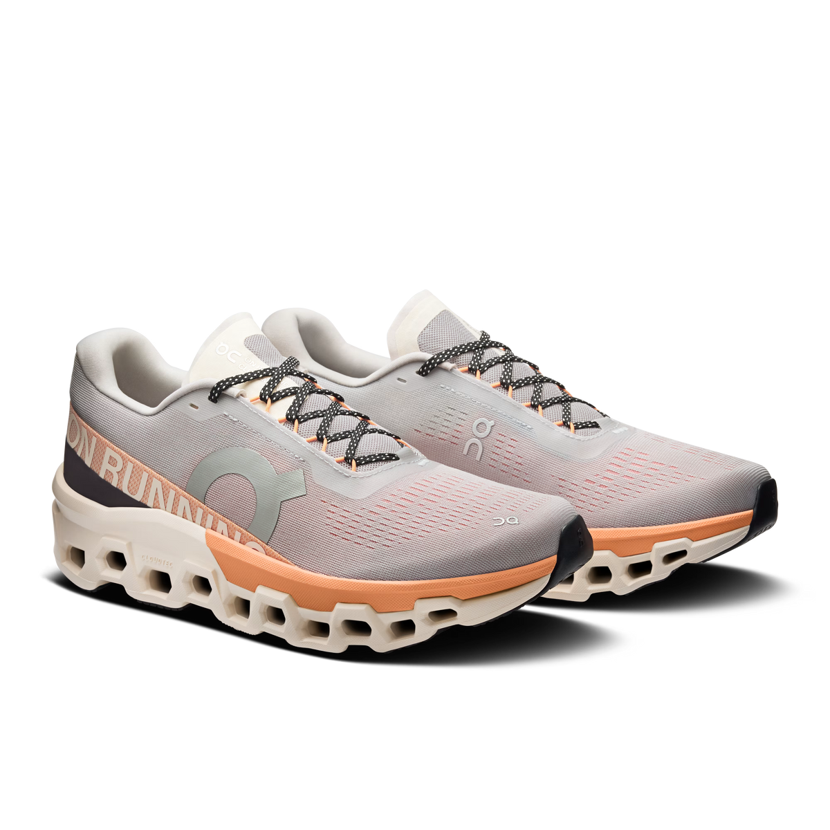 Men's On Cloudmonster 2. Cream and orange upper. Cream and orange midsole. Lateral view.