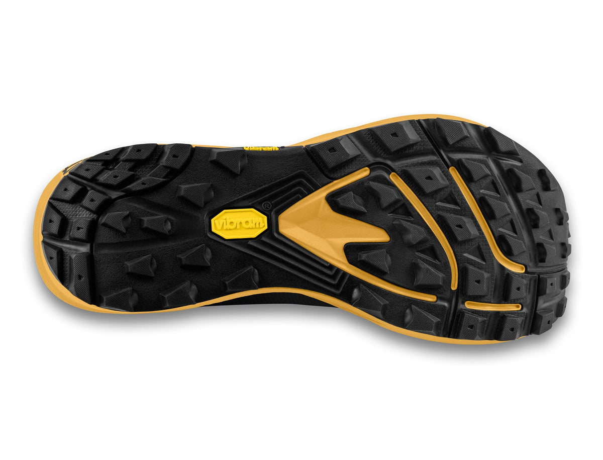 Men's Topo MTN Racer 4. Black upper. Yellow midsole. Bottom view.