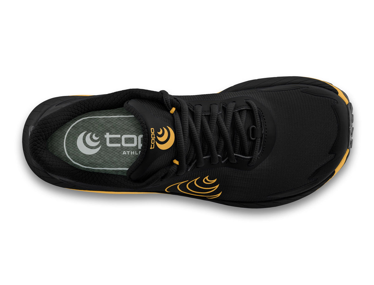 Men's Topo MTN Racer 4. Black upper. Yellow midsole. Top view.