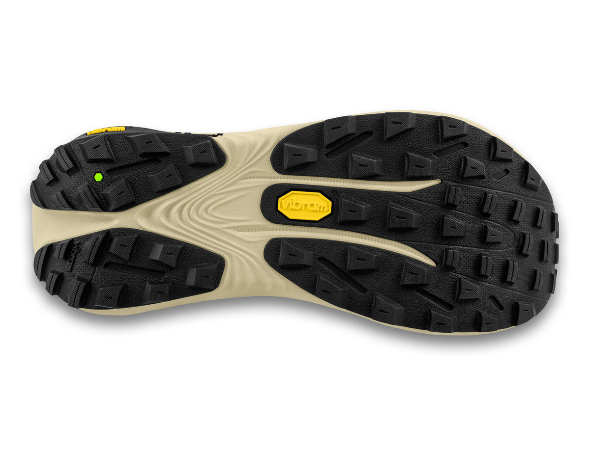 Men's Topo Vista. Black upper. Tan midsole. Bottom view.