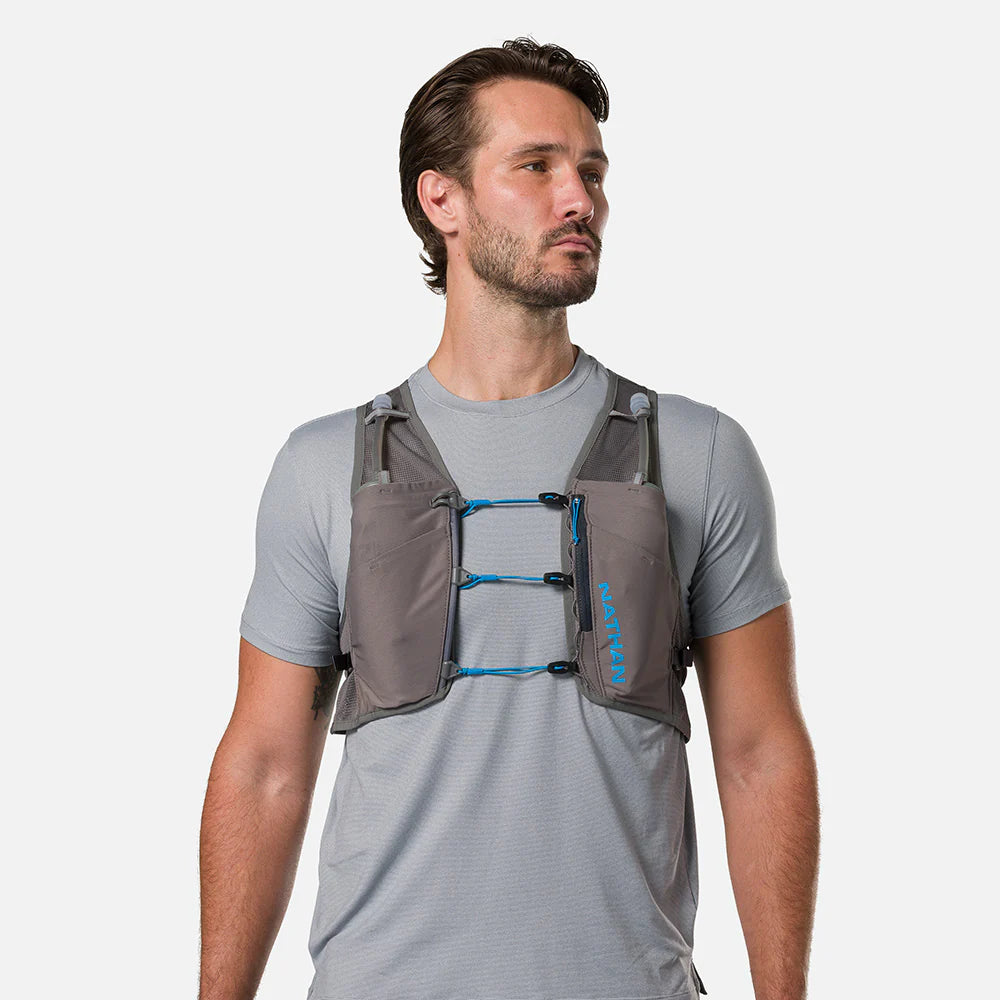 Unisex Nathan Breeze 4 Liter Hydration Vest. Grey with blue logo. Front view.