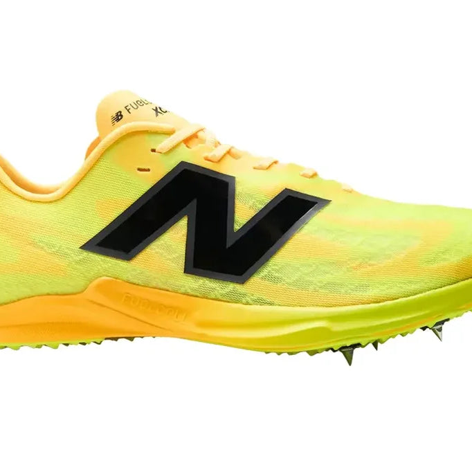 New Balance FuelCell XC-X. Yellow upper. Orange midsole. Lateral view.