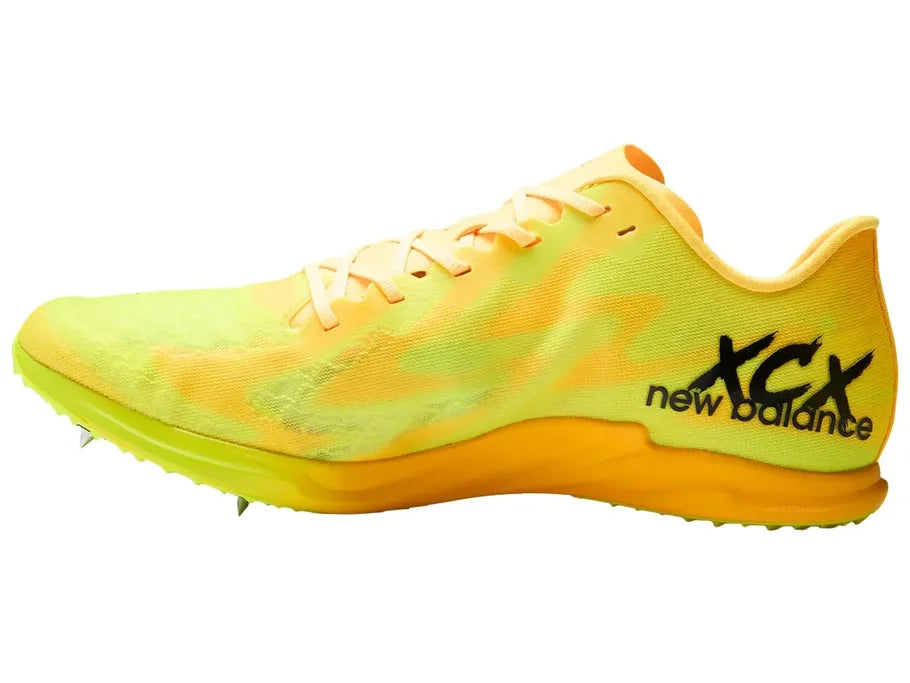New Balance FuelCell XC-X. Yellow upper. Orange midsole. Medial view.