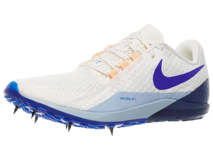 Nike Zoom Rival XC 7. White upper. Blue midsole. Lateral view.
