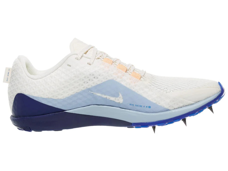 Nike Zoom Rival XC 7. White upper. Blue midsole. Medial view.