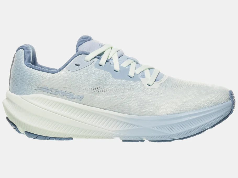 Women's Altra Experience Flow 3. White upper. Light blue midsole. Medial view.