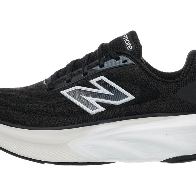 Women's New Balance More v6. Black upper. White midsole. Lateral view.