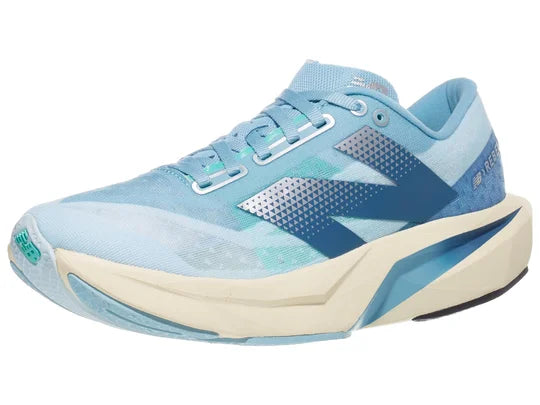 Women's New Balance Rebel v4. Blue upper. Off white midsole. Lateral view.