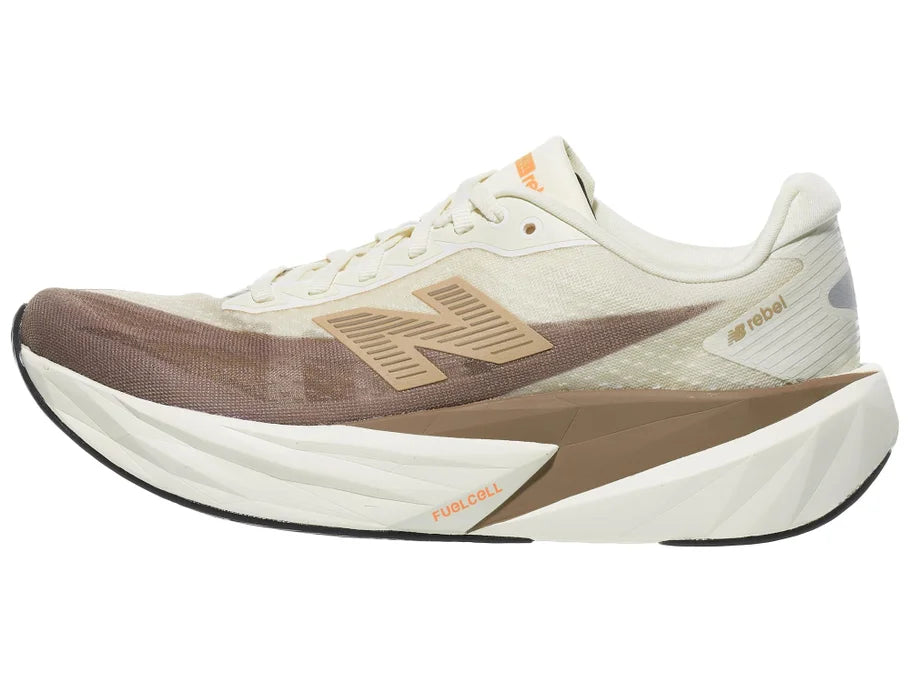 Women's New Balance Rebel v5. Off White/Tan upper. Off White/Tan midsole. Lateral view.