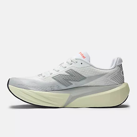 Women's New Balance FuelCell Rebel v5. Grey upper. Off White midsole. Medial view.