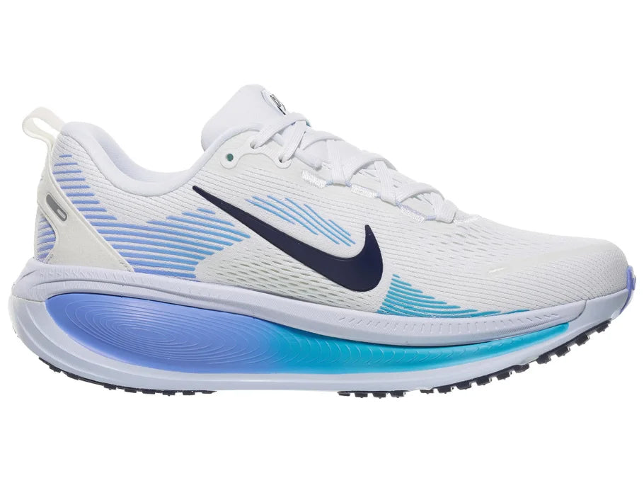 Women's Nike Vomero 18. White upper. Blue midsole. Medial view.