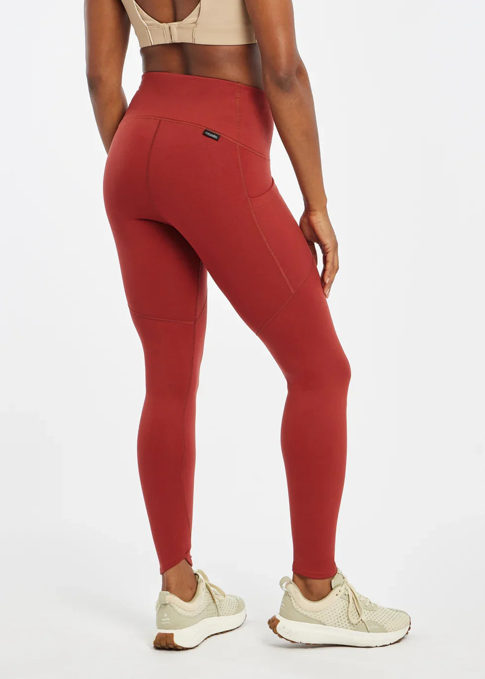 Women's Oiselle Flyout Tights in Redwood red, rear view.