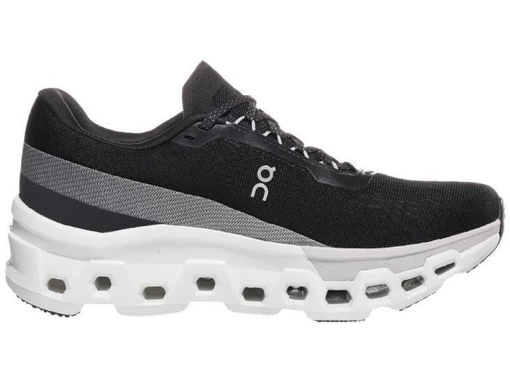 Women's On Cloudmonster 2. Black upper. White midsole. Medial view.