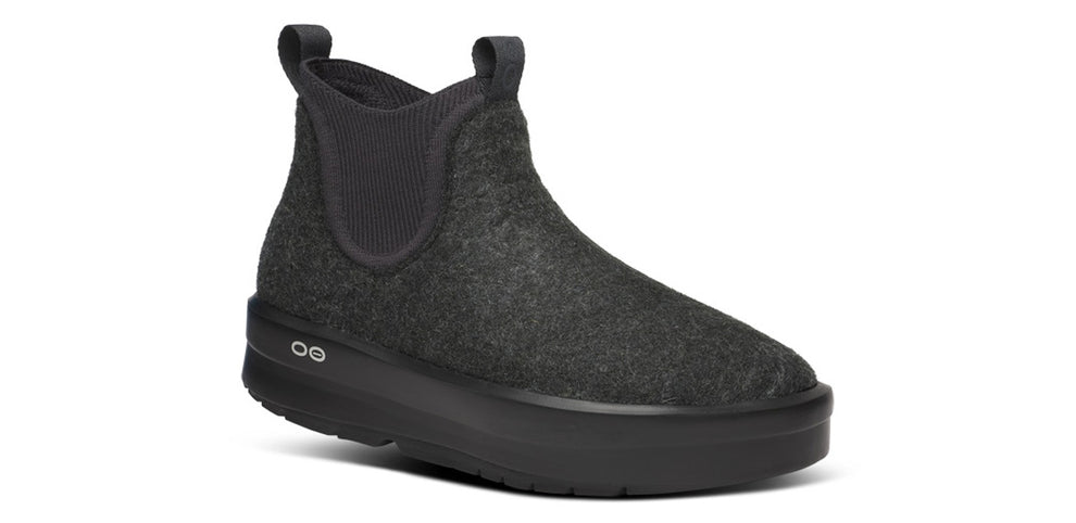 Women's Oofos Londoner Boot. Black upper. Black midsole. Lateral view.