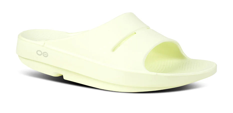 Women's Oofos Ooahh Slide. Light Yellow. Lateral view.